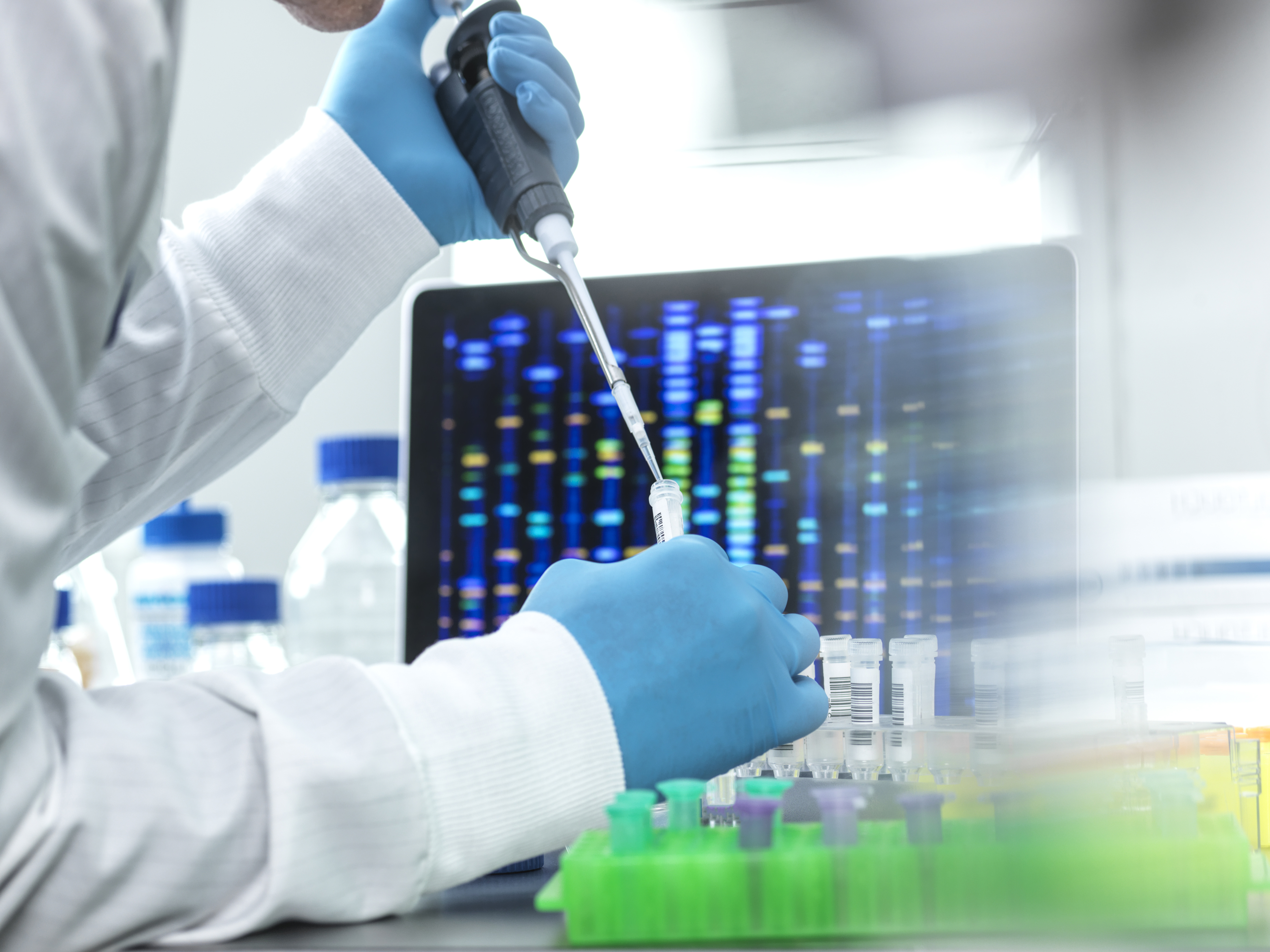 What is a clinical scientist in genetics and molecular pathology?