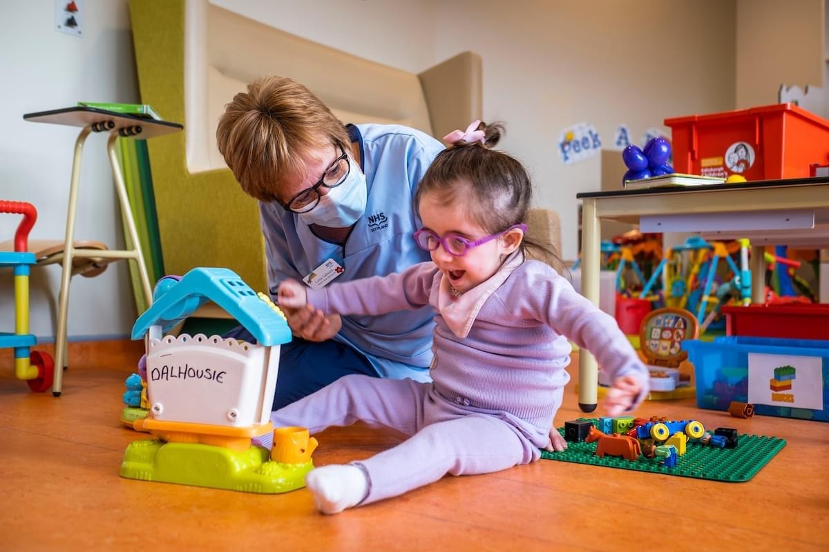 What is a health play specialist?