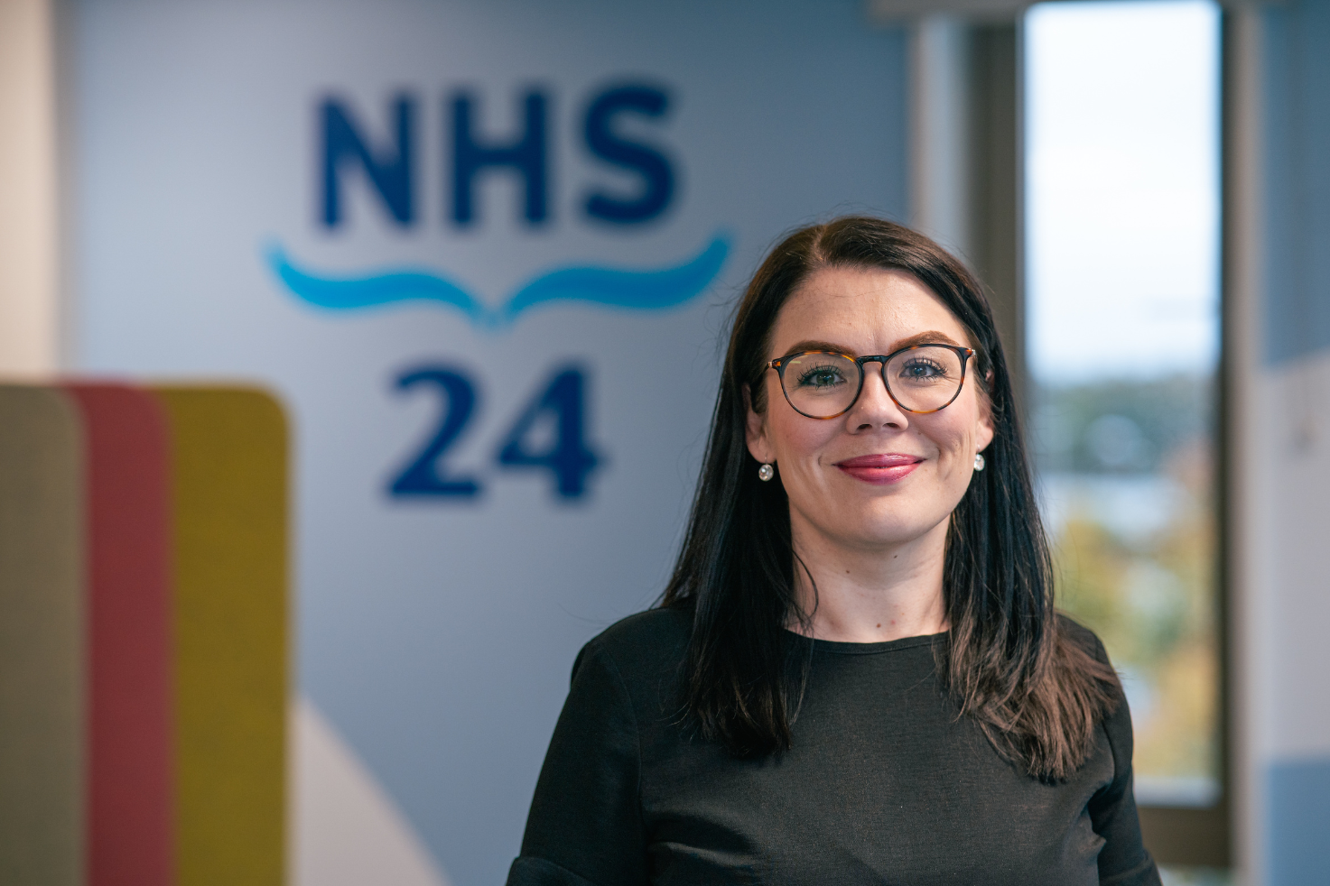 What is an NHS 24 psychological wellbeing practitioner?